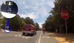 Cyclist blows through the stop sign on Canada, despite cop on the left (who was too busy texting on his iPhone to notice)