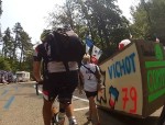 Can't explain this one. A guy walking up Ventoux wearing a big box with a rider's name on it.